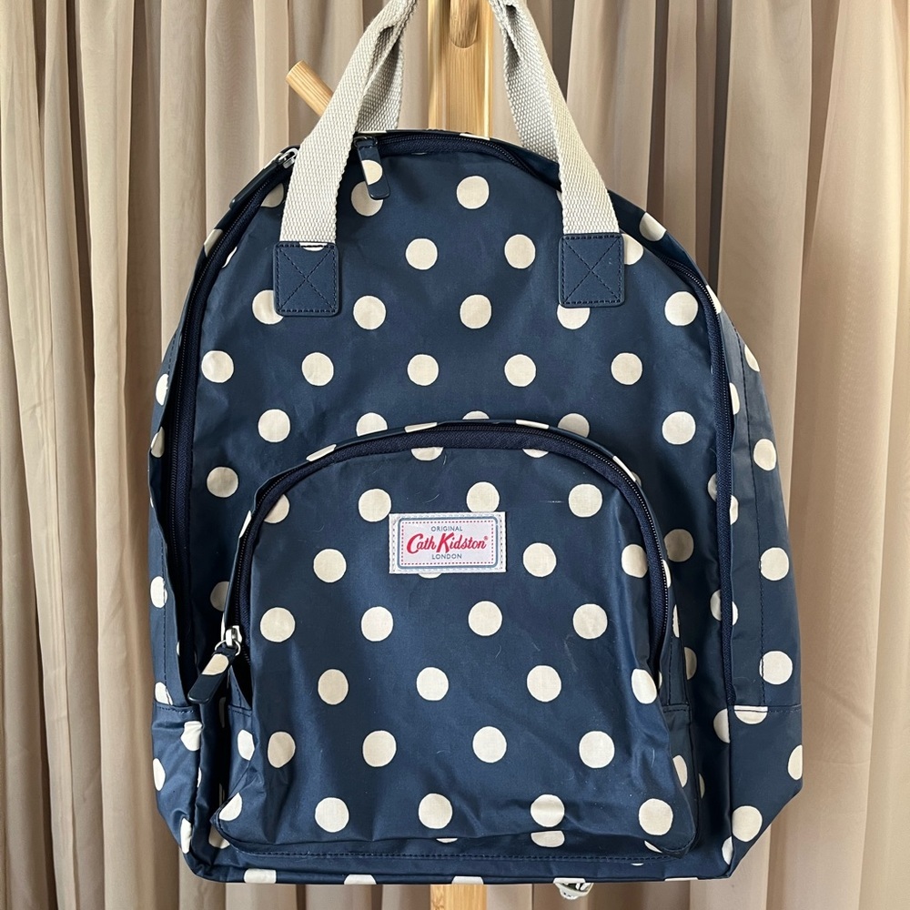 Cath Kidston backpack blue and white polka dots. Looks almost new. $100​